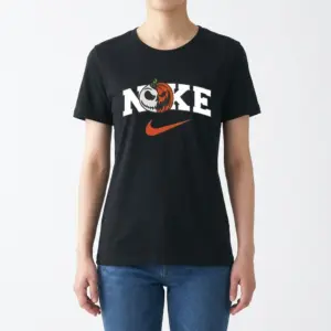 Jack Skellington Pumpkin Halloween Sports Parody Tee 9 Woman modeling a black t-shirt with a spooky Jack Skellington pumpkin sports parody graphic in the 'Noke' logo, front view.