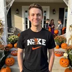 Jack Skellington Pumpkin Halloween Sports Parody Tee 10 Black Jack Skellington pumpkin tee with a humorous sports logo, embodying a festive streetwear style for Halloween.