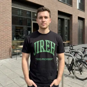 Jireh God Provider Christian T-Shirt 11 Person wearing a Jireh shirt with green text design.