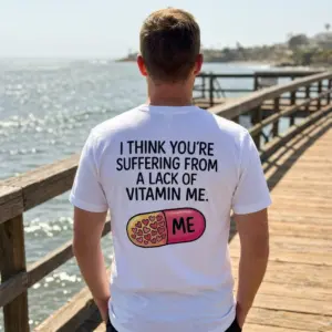 Lack of Vitamin Me Funny Graphic T-Shirt 11 Lifestyle scene highlighting the back print of the funny Lack of Vitamin Me apparel.