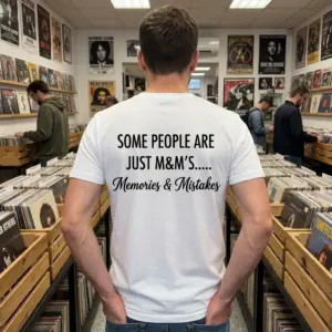 Memories And Mistakes Funny Quote T-Shirt 11 Casual lifestyle scene showing the sarcastic M&M's Memories and Mistakes quote printed on the back of the garment.