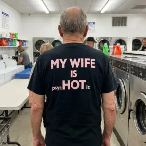 My Wife Is Hot Psychotic Funny T-Shirt 10 Lifestyle view of the playful “My wife is psycHOTic” design for a funny husband shirt.