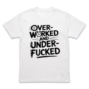 Flat lay of a white t-shirt featuring black hand-lettered text that reads OVER-WORKED AND UNDER-FUCKED with a stressed face and clock icon.