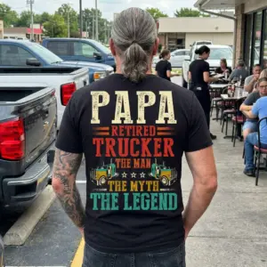 Papa Retired Trucker Legend T-Shirt 11 Close-up on 'Papa Retired Trucker Legend' T-shirt worn outdoors.