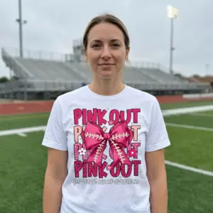 Pink Out Football Bow Breast Cancer T-Shirt 11 White sports shirt featuring a vibrant pink football bow over "PINK OUT" text in various pinks, highlighting breast cancer awareness.