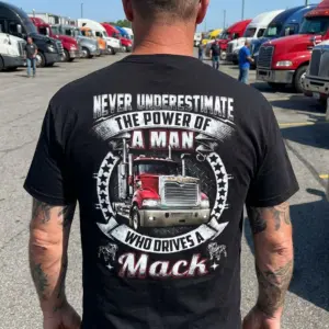 Powerful Mack Truck Driver T-Shirt 10 Person wearing a Mack truck t-shirt in a casual lifestyle setting.