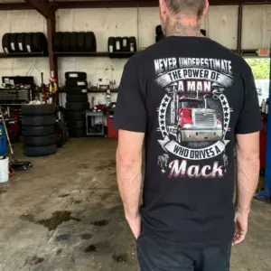Powerful Mack Truck Driver T-Shirt 11 Individual casually dressed in a Mack truck t-shirt in an everyday environment.