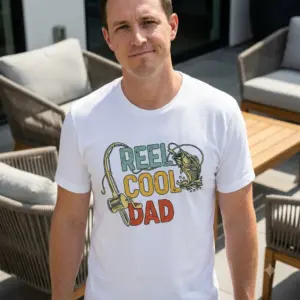Reel Cool Dad Fishing Graphic T-Shirt 10 Lifestyle view of the Reel Cool Dad shirt worn outdoors.