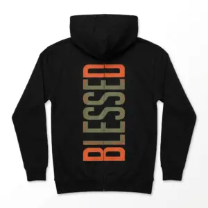 Retro Blessed Vertical Graphic T-Shirt 7 Upper back close-up of the Blessed Graphic T-Shirt, showing vertical orange and green distressed text.