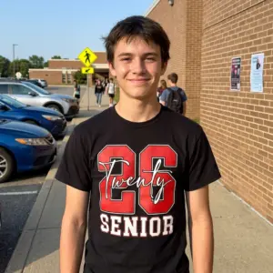 Senior Class of 2026 Varsity Graphic T-Shirt 11 Person wearing a Senior Class of 2026 varsity T-shirt in a casual setting.