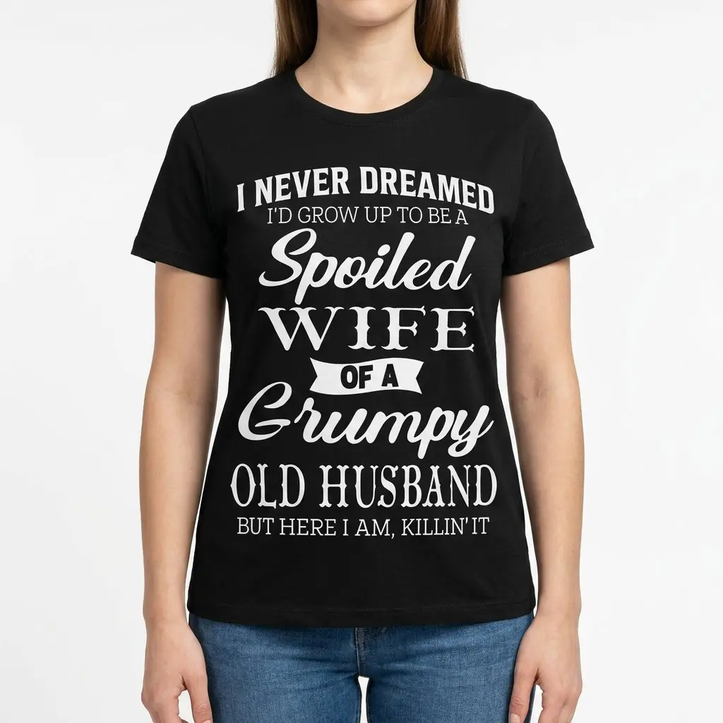 Spoiled Wife of a Grumpy Husband T-Shirt 4 Woman wearing a T-shirt with amusing text about being a spoiled wife.