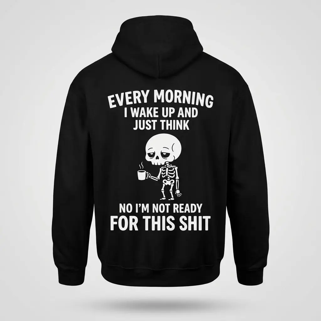 Back view of a black hoodie printed with an exhausted skeleton holding a coffee mug and funny morning text.