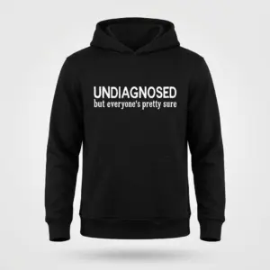 Undiagnosed But Everyone's Pretty Sure T-Shirt 7 Black hoodie flat lay with the text Undiagnosed but everyone's pretty sure printed in white across the chest.