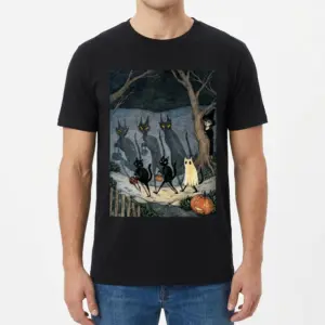 Vintage Spooky Cats Trick or Treating T-Shirt 9 Male model wearing a black t-shirt printed with vintage spooky cats trick-or-treating in an eerie forest scene.