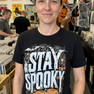 Vintage Stay Spooky Halloween Graphic T-Shirt 11 The front of a black t-shirt featuring a fun 'STAY SPOOKY' Halloween design with distressed text and surrounding spooky elements.