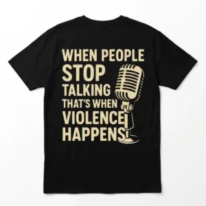 Back flat lay of a black free speech shirt reading When People Stop Talking That's When Violence Happens beside a mic