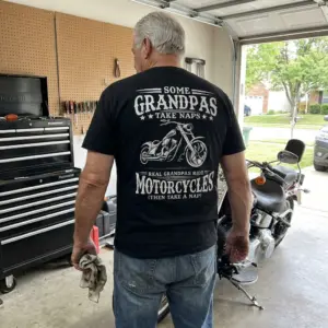 Funny Biker Grandpa Motorcycle Nap T-Shirt 10 Lifestyle view showcasing the back of the funny biker grandpa motorcycle shirt.