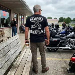 Funny Biker Grandpa Motorcycle Nap T-Shirt 11 Casual lifestyle setting displaying the biker grandpa motorcycle graphic apparel.