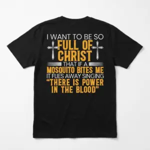 Back flat lay of a black t-shirt with a humorous Christian quote about being full of Christ so a biting mosquito sings a gospel hymn.