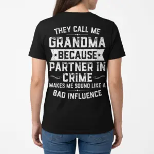 Funny Grandma Partner In Crime T-Shirt 9 Woman model wearing a white t-shirt, back view showing a funny grandma partner in crime quote graphic