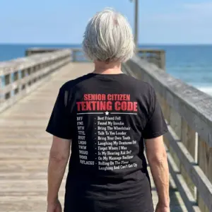 Funny Senior Citizen Texting Code T-Shirt 11 Lifestyle view highlighting the humorous Senior Citizen Texting Code graphic on the back of the garment.