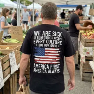 America First America Always Patriotic Flag Back Print Tee 10 Candid outdoor rear view of a man wearing the black America First America Always Patriotic Flag Back Print Tee