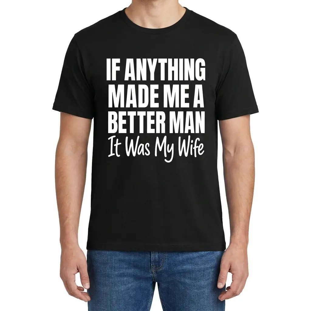 Male model wearing a black Better Man Because Of My Wife t-shirt, front view
