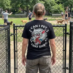 Can I Pet That Dawg Traditional Wolf Tattoo T-Shirt 11 Close-up casual look showcasing black tee and black tee back print reading CAN I PET THAT DAWG around a traditional tattoo snarling wolf head