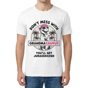 Don't Mess With Grandmasaurus You'll Get Jurasskicked Tee 9 Man wearing white graphic tee with white tee front print reading DONT MESS WITH GRANDMASAURUS YOULL GET JURASSKICKED with a T-Rex wearing a pink bandana