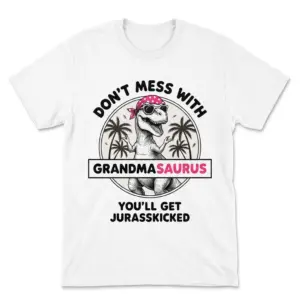Flatlay white t-shirt featuring white tee front print reading DONT MESS WITH GRANDMASAURUS YOULL GET JURASSKICKED with a T-Rex wearing a pink bandana