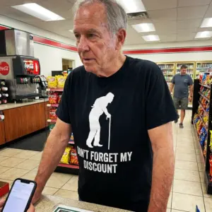 Funny Don't Forget My Discount Senior Citizen T-Shirt 10 Lifestyle setting showcasing the Don't Forget My Discount senior citizen graphic shirt.