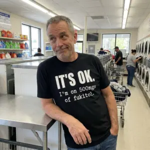 Funny Fukitol Prescription Humor T-Shirt 11 Casual lifestyle setting highlighting the humorous 500mgs of fukitol graphic top.