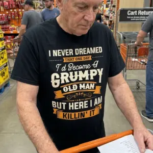 Funny Grumpy Old Man Killin It T-Shirt 10 Lifestyle view of the Grumpy Old Man Killin' It shirt displayed in an everyday setting.