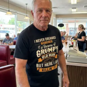 Funny Grumpy Old Man Killin It T-Shirt 11 Lifestyle presentation showcasing the funny Grumpy Old Man graphic apparel.