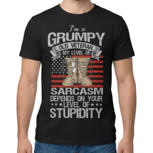 Funny Grumpy Old Veteran Sarcasm T-Shirt 9 Man modeling the shirt from the front, showing the grumpy veteran sarcasm graphic with combat boots and American flag details.