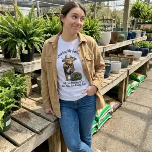 Funny Highland Cow Bush Joke T-Shirt 10 Lifestyle presentation of the funny highland cow joke apparel in a casual setting.