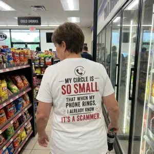 Funny Introvert My Circle Is So Small T-Shirt 11 Casual lifestyle setting showcasing the back print of the funny introvert scammer joke shirt.