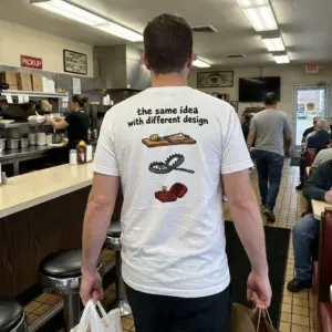 Funny Marriage Is a Trap Graphic T-Shirt 10 Lifestyle view highlighting the humorous marriage trap graphic printed across the back of the shirt.