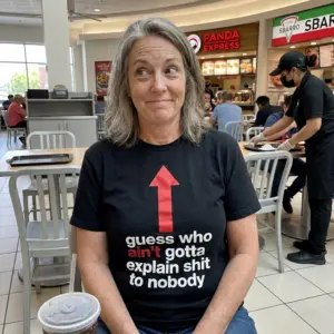 Funny No-Explanation Attitude T-Shirt 10 Lifestyle view of the shirt featuring a red upward arrow and bold no-explanation attitude slogan.