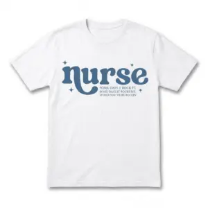 Front view of a white funny nurse T-shirt with blue “nurse” lettering, star accents and a witty rocking-it slogan.