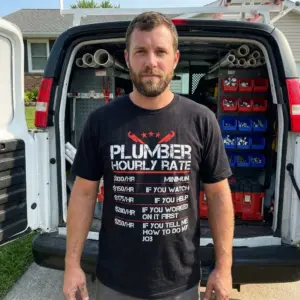 Funny Plumber Hourly Rate T-Shirt 11 Humorous plumber hourly rate shirt displayed in an everyday casual lifestyle setting.