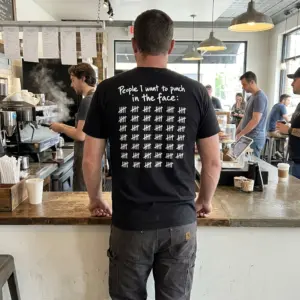 Funny Tally Mark People T-Shirt 10 T-shirt lifestyle view featuring the phrase “People I want to punch in the face” and rows of tally marks.