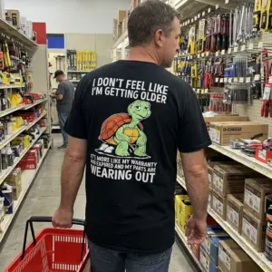 Funny Turtle Warranty Expired Getting Older T-Shirt 10 Lifestyle setting featuring the warranty expired shirt with a tired cartoon turtle and humorous quote about getting older.