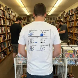 Funny Yes or No Questionnaire T-Shirt 10 Lifestyle view of the T-shirt featuring a humorous six-question yes-or-no graphic with blue marks.