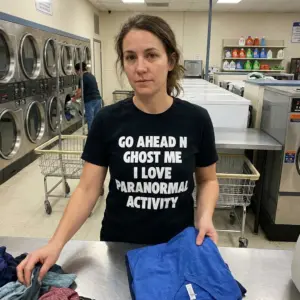 Go Ahead N Ghost Me I Love Paranormal Activity T-Shirt 10 Everyday streetwear outfit styling black shirt with black tee front print reading GO AHEAD N GHOST ME I LOVE PARANORMAL ACTIVITY in bold white letters