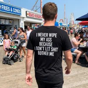 I Never Wipe My Ass Because I Don't Let Shit Bother Me T-Shirt 10 Casual back lifestyle shot of the I Never Wipe My Ass Don't Let Shit Bother Me funny tee