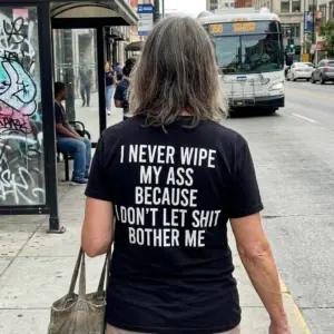 I Never Wipe My Ass Because I Don't Let Shit Bother Me T-Shirt 11 Outdoor back view showcasing the Don't Let Shit Bother Me funny adult humor shirt