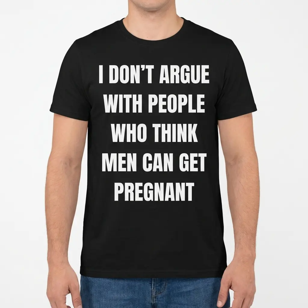 Man wearing the black T-shirt with the white men can get pregnant statement on the front.