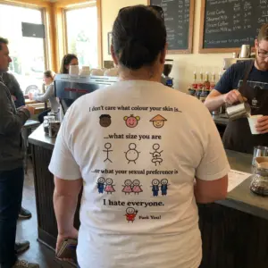 I Don't Care Who You Are I Hate Everyone Sarcastic T-Shirt 11 Close-up casual look showcasing white tee and back print reading I don't care what colour your skin is what size you are I hate everyone with stick figure