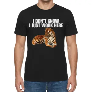 I Don't Know I Just Work Here Lounging Tiger T-Shirt 9 Man wearing black graphic tee with black tee front print reading I DONT KNOW I JUST WORK HERE above a lounging orange tiger